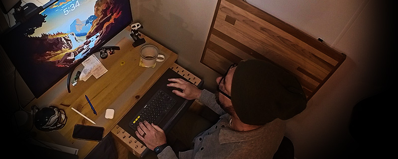 Overhead view of the desk with laptop and monitor